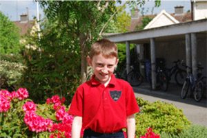photo of boy in red polo shirt